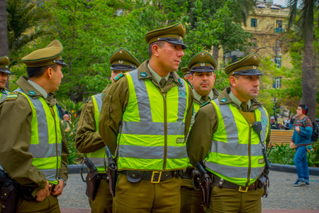SANTIAGO, CHILE - SEPTEMBER 13, 2018: Outdoor view of crowd of Police called as carabineros in the line ready to check the crowd for segurity in Santiagoのeditorial素材