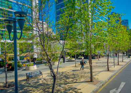SANTIAGO, CHILE - OCTOBER 16, 2018: Outdoor view of gorgeous financial center buildings district in Las Condes with some plants in the sidewalkのeditorial素材