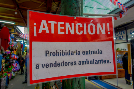 SANTIAGO, CHILE - SEPTEMBER 14, 2018: Close up of selective focus of informative sign inside of market located in the center of Santiagoのeditorial素材