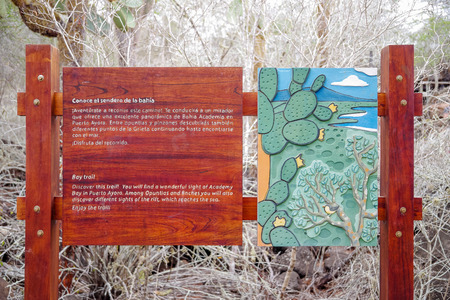 Puerto Ayora, Galapagos, Ecuador - November 25, 2018: Outdoor view of informative wooden sign of Bay trail on Isabela Island. Galapagos Islandsのeditorial素材