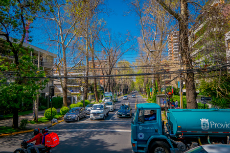 SANTIAGO, CHILE - SEPTEMBER 13, 2018: Outdoor view of cars in the street surrounded of plants during gorgeous beautiful sunny day at Santiago of Chileのeditorial素材