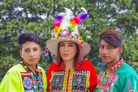 Quito, Ecuador, December, 12 2018: Outdoor view of group of people wearing typical folklore clothes used for performances dancing on the street of old town Quitoのeditorial素材
