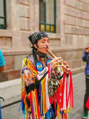 Quito, Ecuador, September 29, 2019: Music indigenous street performers in the historic centre of Quito, Ecuador.のeditorial素材