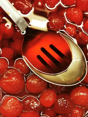 Sweet cherries in sauce. sweet cherries in domestic prepared for homemade sauce.の写真素材