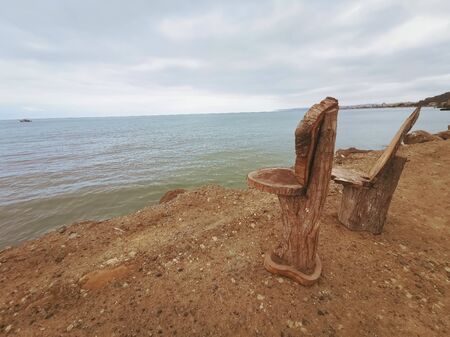 Sua, Ecuador, October 03, 2019: Tree trunk chairs in the town of Sua beach in Ecuadorのeditorial素材