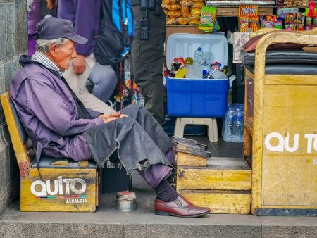 Quito, Ecuador, September 29, 2019: Local shoe shinner at the historic centre of Quito, Ecuador. Proclaimed by the Unesco.のeditorial素材