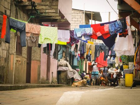 Sua, Ecuador, October 03, 2019: Slums streets in the town of Sua beach in Ecuador. Clothes hanging in thre street.のeditorial素材