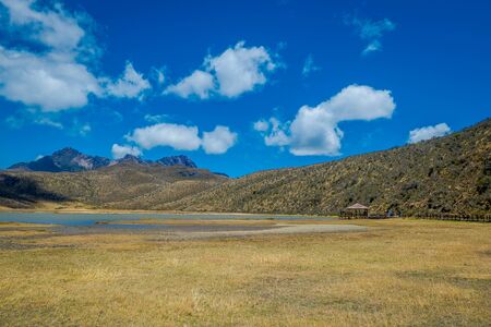 Shore of the lake Limpiopungo located in Cotopaxi national park, Ecuador in a sunny and windy day.の写真素材