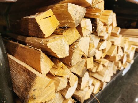 Fire wood stack, selective focus applied, close up.の写真素材
