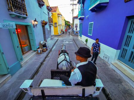 CARTAGENA, COLOMBIA - NOVEMBER 09, 2019: Horse drawn touristic carriages in the historic Spanish colonial city of Cartagena de Indias, Colombia.のeditorial素材
