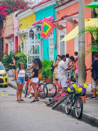 CARTAGENA, COLOMBIA - NOVEMBER 12, 2019: Unidentified tourists and vendors at the Streets of the Getsemani neighborhood of Cartagena, Colombia.のeditorial素材
