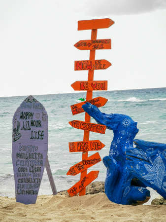 BARU, CARTAGENA, COLOMBIA - NOVEMBER 09, 2019: signs on paradise beach of Playa Blanca on Island Baru by Cartagena in Colombia.のeditorial素材