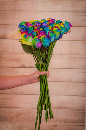 A bouquet of Tinted Rainbow roses variety, studio shot, multicolored flowers. High quality photoの写真素材