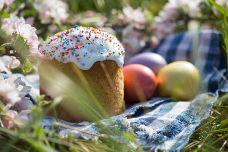 Photo of Easter cake and eggs. Traditional Russian and Ukrainian Easter cake kulich and painted eggs.の写真素材
