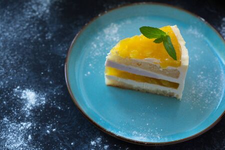 Mango fruit Mousse Cake, decorated with fresh fruits in jelly. Whipped cheese with biscuits.の写真素材
