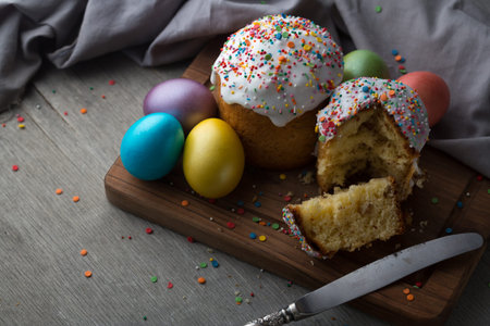 Photo of Easter cake and eggs. Traditional Russian and Ukrainian Easter cake kulich and painted...