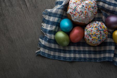 Photo of Easter cake and eggs. Traditional Russian and Ukrainian Easter cake kulich and painted eggs.の写真素材