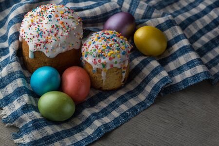 Photo of Easter cake and eggs. Traditional Russian and Ukrainian Easter cake kulich and painted eggs.の写真素材