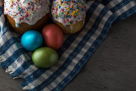 Photo of Easter cake and eggs. Traditional Russian and Ukrainian Easter cake kulich and painted eggs.の写真素材