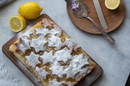 Piece of lemon pie for a breakfast. Piece of lemon pie for a breakfast on a light background.の写真素材
