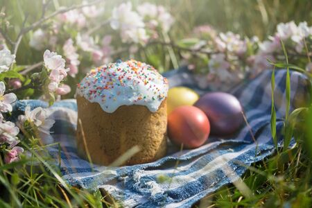 Photo of Easter cake and eggs. Traditional Russian and Ukrainian Easter cake kulich and painted eggs.の写真素材