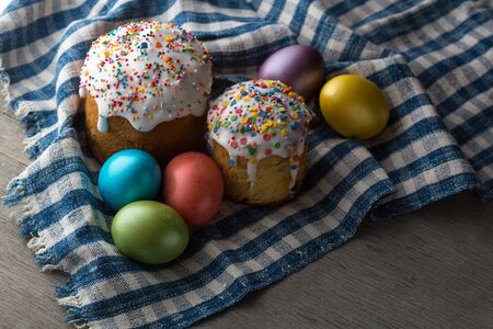 Photo of Easter cake and eggs. Traditional Russian and Ukrainian Easter cake kulich and painted eggs.の写真素材