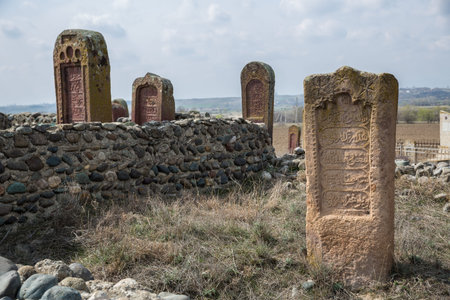Ancient muslim cemetery near Agstafa, Azerbaijan with writings on farsi for graphic and web design, for website or mobile appの写真素材