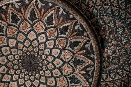 Copper plate handcrafted, traditionally made in Lagich, Azerbaijan. Handmade plate in souvenir shopの写真素材