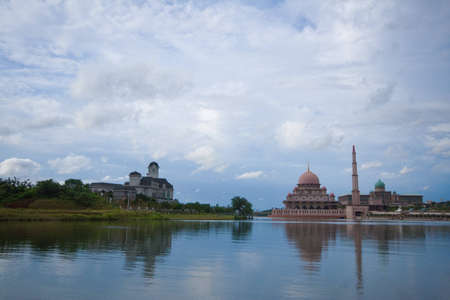 Putra Mosque is the principal mosque of Putrajaya, Malaysia. Building on the left is Perdana Putra which is Malaysian Prime Minister's officeの写真素材