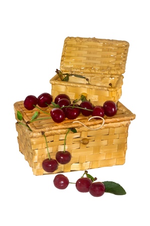 ripe cherries on a wicker basketの写真素材