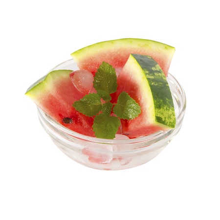 plate of with three slices of watermelon, ice and mint on a white backgroundの写真素材
