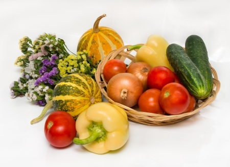 autumn vegetables with flowers  tomatoes, peppers, melon onions   isolate on a white backgroundの写真素材