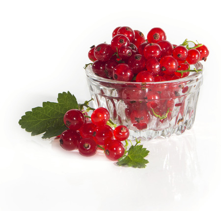 fresh redcurrant in a glass container closeupの写真素材