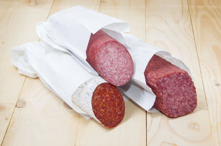 Different sorts  of salami in paper packagingの写真素材