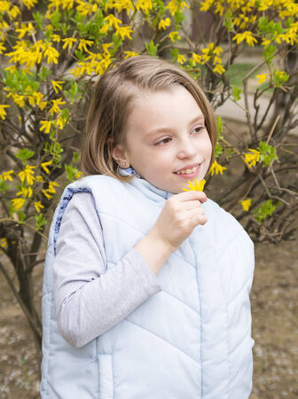 Portrait of beautiful little girl in springtimeの写真素材