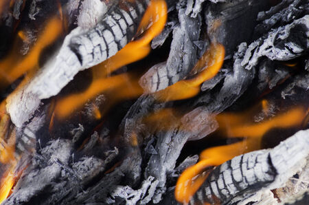 Fire coals after wooden camp fire.の写真素材