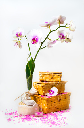 Spa composition. The branch of white orchids and boxes of curative salt and other spa objects.の写真素材