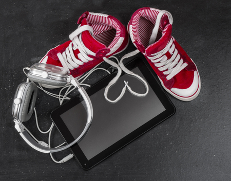 Love for music concept. Red sneakers, headphones, tablet .の写真素材