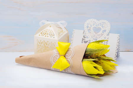decorative flowers and gift with a card for text on wooden backgroundの写真素材