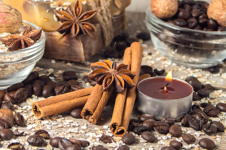 Spa still life with cinnamon and coffee beans,candle  on a wooden background. Soft focus.の写真素材