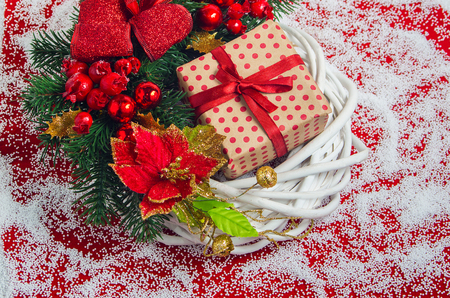 Christmas wreath with a gift box on the eve of the holidayの写真素材