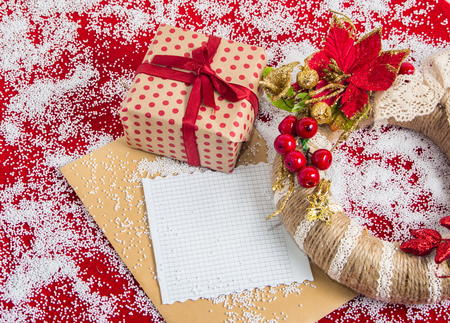 Christmas background.Christmas wreath with a gift box before the holiday and place for text.の写真素材