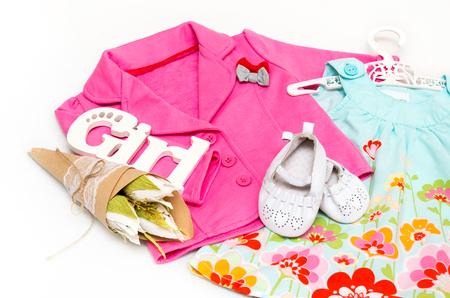 Set of clothes for the little girl. Pink jacket, dress, booties.の写真素材