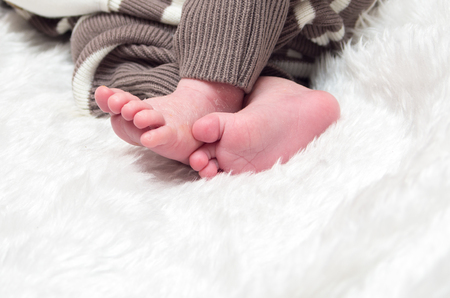 Little legs of a newborn babyの写真素材