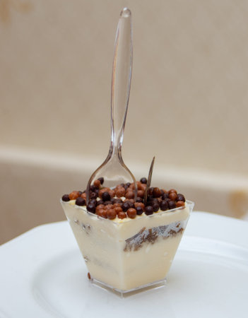 mini dessert cappuccino -chocolate in a cup with a spoon. desserts in a cup