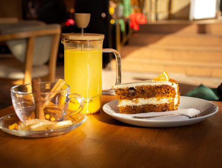 ginger sea buckthorn tea with cinnamon sticks and honey on a wooden table