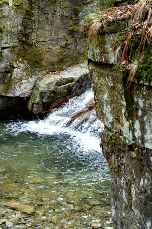mountain river in autumn with rocks and waterfalls. natural environmental detailの写真素材