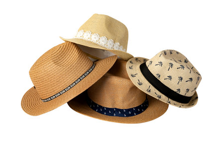 Set of stylish straw hats cut out on white background. Stylish summer headwear for traveling on the beach during vacation.の写真素材
