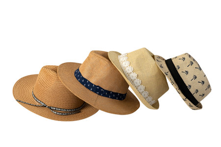 Set of stylish straw hats isolated on white background with space for text. Stylish summer headdress for beach travel during vacation.の写真素材