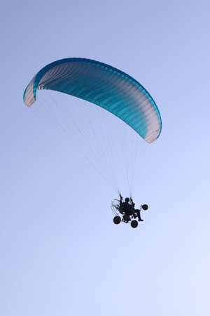 Flying paraglider in the sky